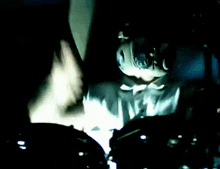 a close up of a drum set with a person playing it