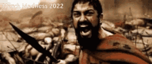 a man with a beard is holding a sword in a march madness 2022 poster