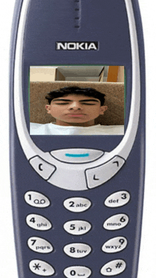 a nokia cell phone with a picture of a man on the screen