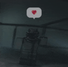 a person in a hat is standing in a dark room with a speech bubble with a heart in it .