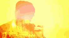 a double exposure of a man eating a sandwich with a mountain in the background