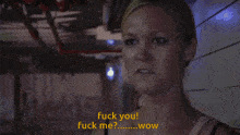 a man and a woman are standing next to each other and the woman is saying " fuck you "
