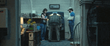 a group of people standing around a jukebox with a sign above it that says lottery ticket