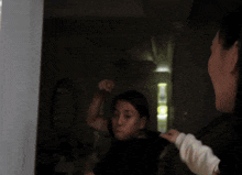 a blurry picture of a woman in a blue shirt