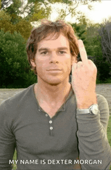 a man giving the middle finger with the caption " my name is dexter morgan " below him