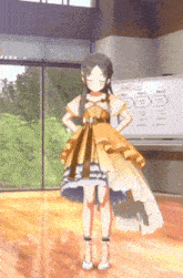 a girl in a yellow dress is standing in front of a white board that says ' a ' on it