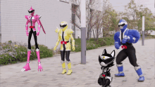 a group of cartoon characters standing on a sidewalk including a black cat