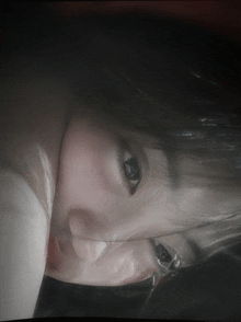 a close up of a woman 's face with her eyes visible