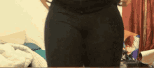 a person standing in front of a bed with a picture of todoroki on it
