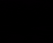 a close up of a person 's face with glowing eyes in the dark