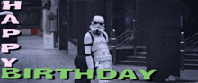 a storm trooper is standing on a street with the words happy birthday behind him