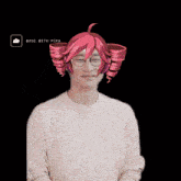 a man wearing glasses and a pink wig that says made with pika on it