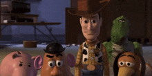 a group of toy story characters including woody mr potato head rex and slinky dog