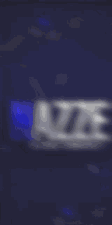 a blurry picture of the word name on a dark blue background