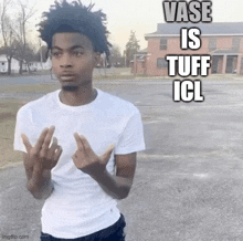 a man in a white shirt is giving the middle finger in a parking lot with the words vase is tuff icl above him