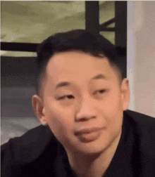 a close up of a man 's face with his eyes closed and his mouth open .