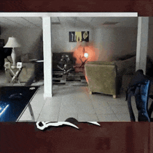 a living room with a painting on the wall that says ' a ' on it