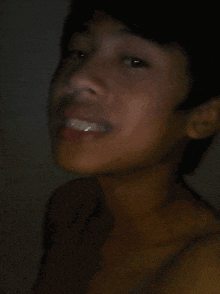 a close up of a person 's face with a blurred background