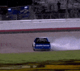 a race car is driving on a track and the back of the car says bfgoodrich