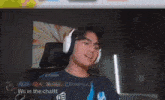 a man wearing glasses and headphones is smiling in front of a banner that says subscription leaderboard
