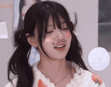 a girl with a swirl on her face