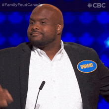 a man wearing a name tag that says dwight