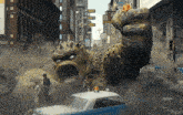 a large monster is attacking a city street with a police car in the foreground and the word kepler on the bottom right