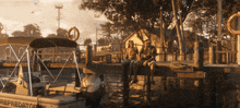 a man and woman sit on a dock next to a boat that says predator on the side