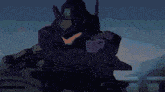 a purple robot is holding a gun in a video game and looking at the camera .