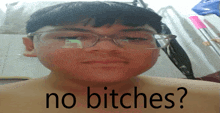 a boy wearing glasses says no bitches