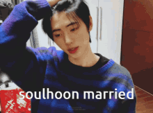 a young man in a blue and purple sweater has the words soulhoon married on the bottom right