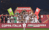 a group of soccer players are posing for a photo in front of a sign that says champions coppa italia frecciarossa