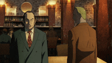 two men in suits and ties are standing next to each other