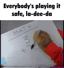 a person is writing on a piece of paper that says math on it