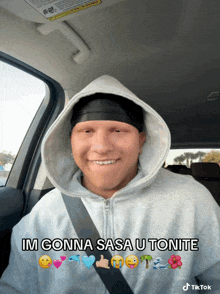 a man wearing a hoodie and a black headband says im gonna sasa utonite