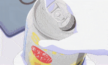 a person is opening a can of soda with chinese writing
