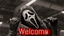 a person wearing a scream mask is standing next to a sign that says welcome